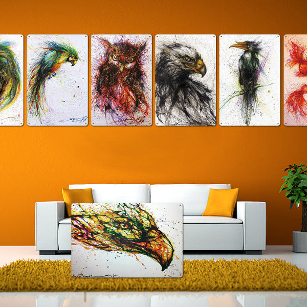 Set of six colorful animal paintings on a wall with a white sofa and green rug.