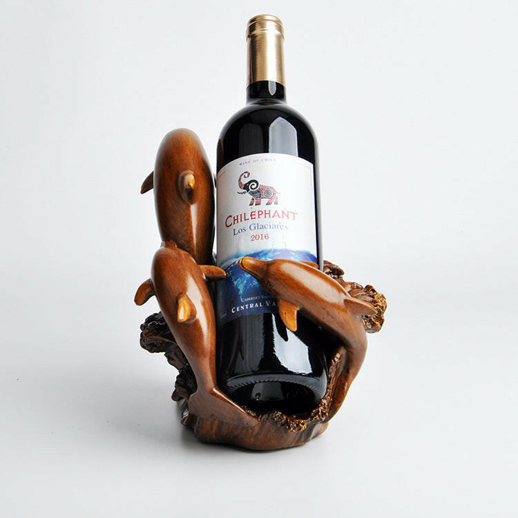 Wine bottle in a wooden holder with a white background