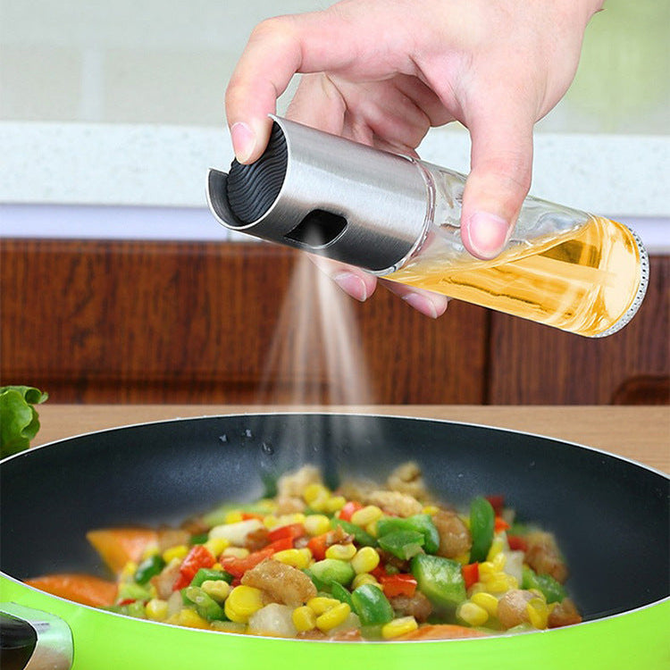 Hand using a salt shaker over a pan of stir-fry vegetables.
