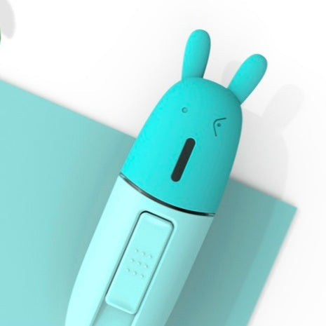 Turquoise-colored electronic device with rabbit-like design on a light blue background