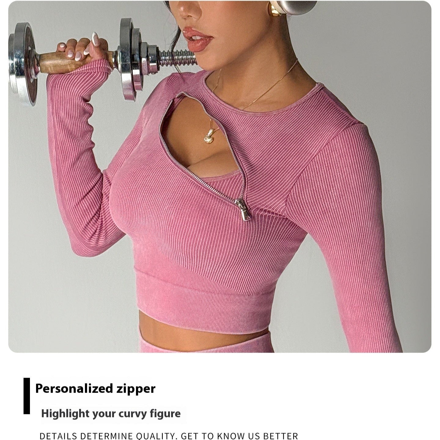 Person wearing a pink long-sleeve top with a personalized zipper, lifting a dumbbell.