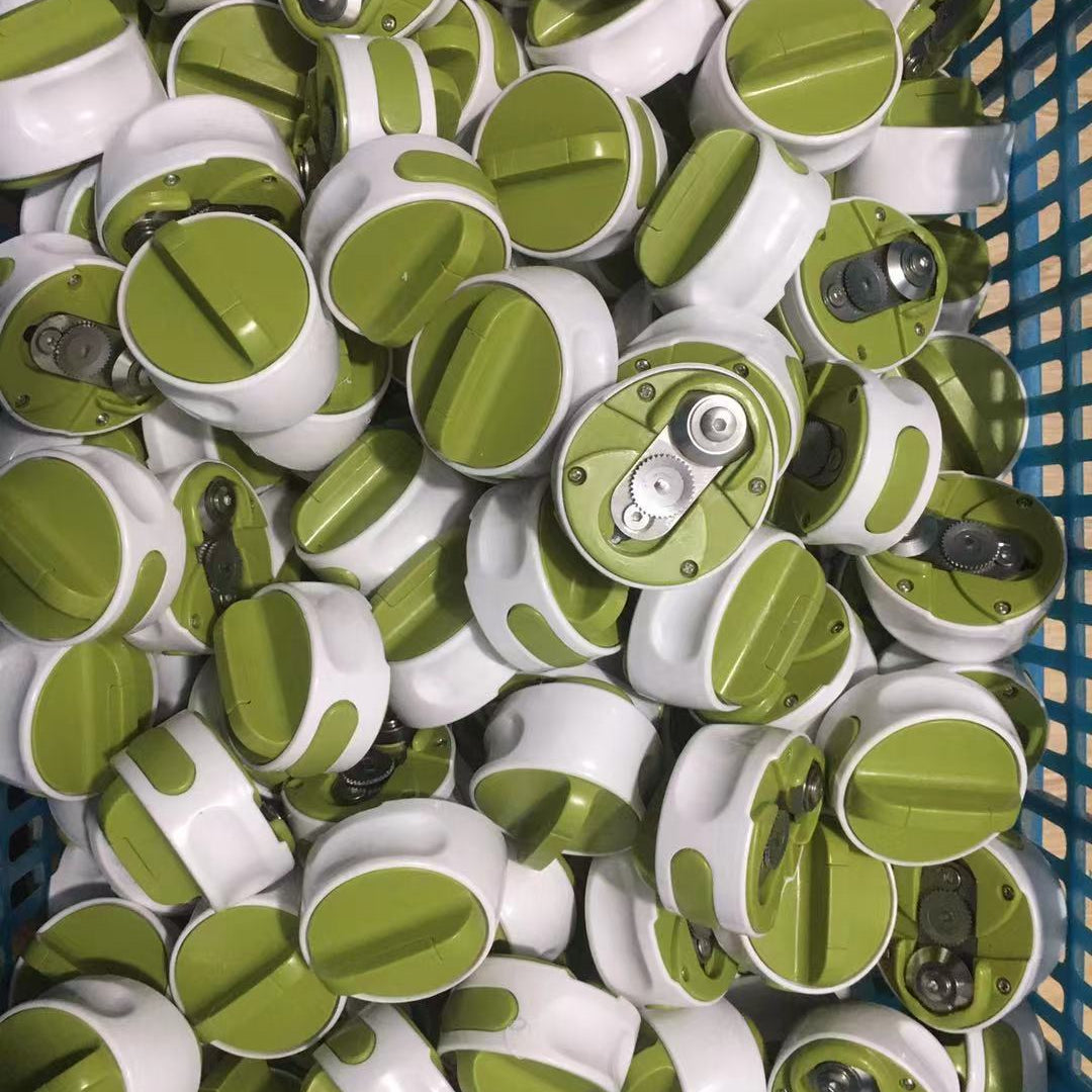 Pile of green and white cylindrical objects in a blue basket
