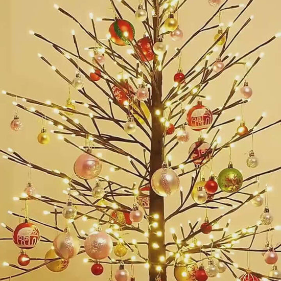 Colorful 6cm Christmas tree decorations on a beautifully lit holiday tree.